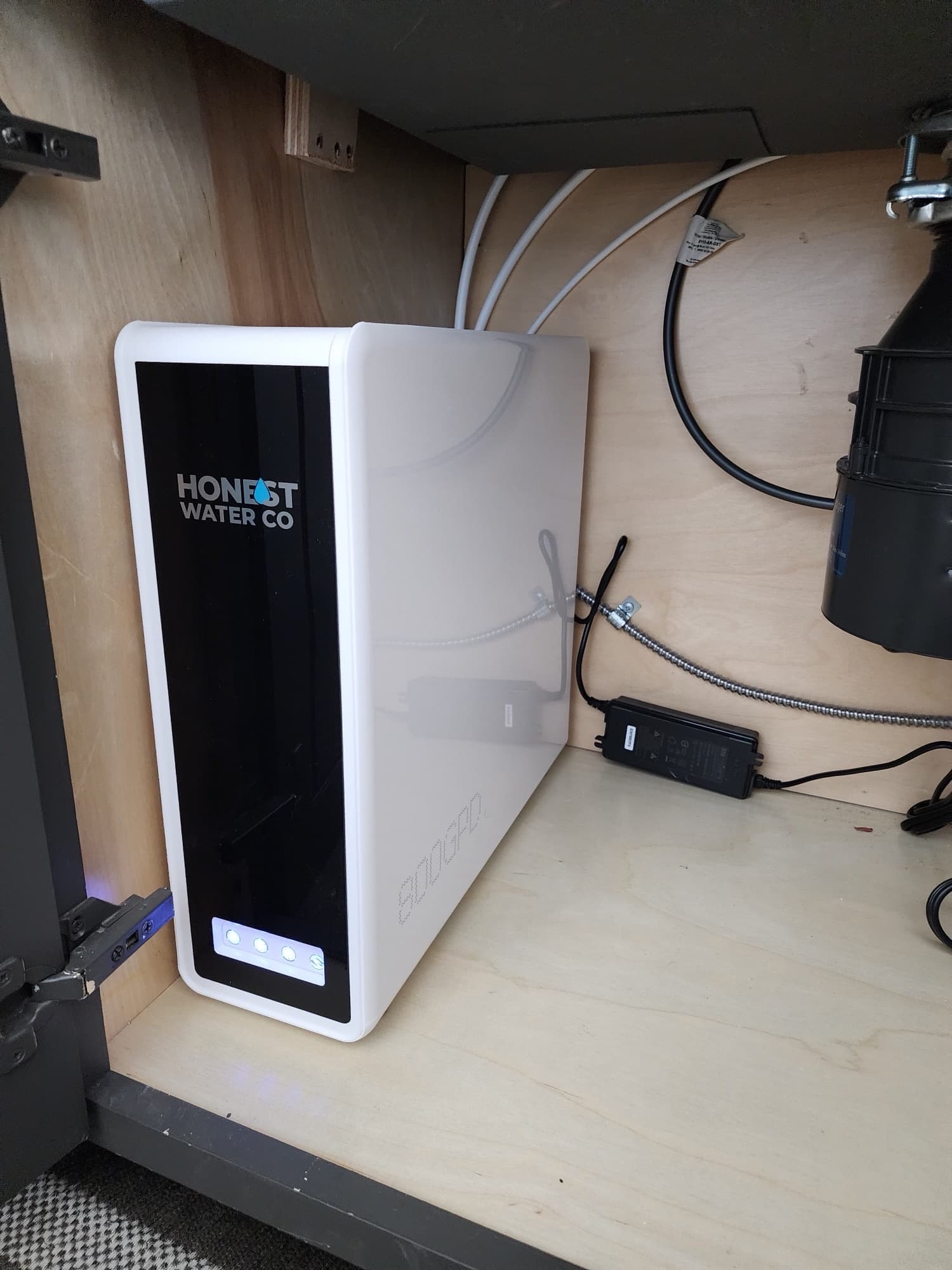 Honest Water Co HW800 AlkaPro tankless reverse osmosis unit installed in a cabinet