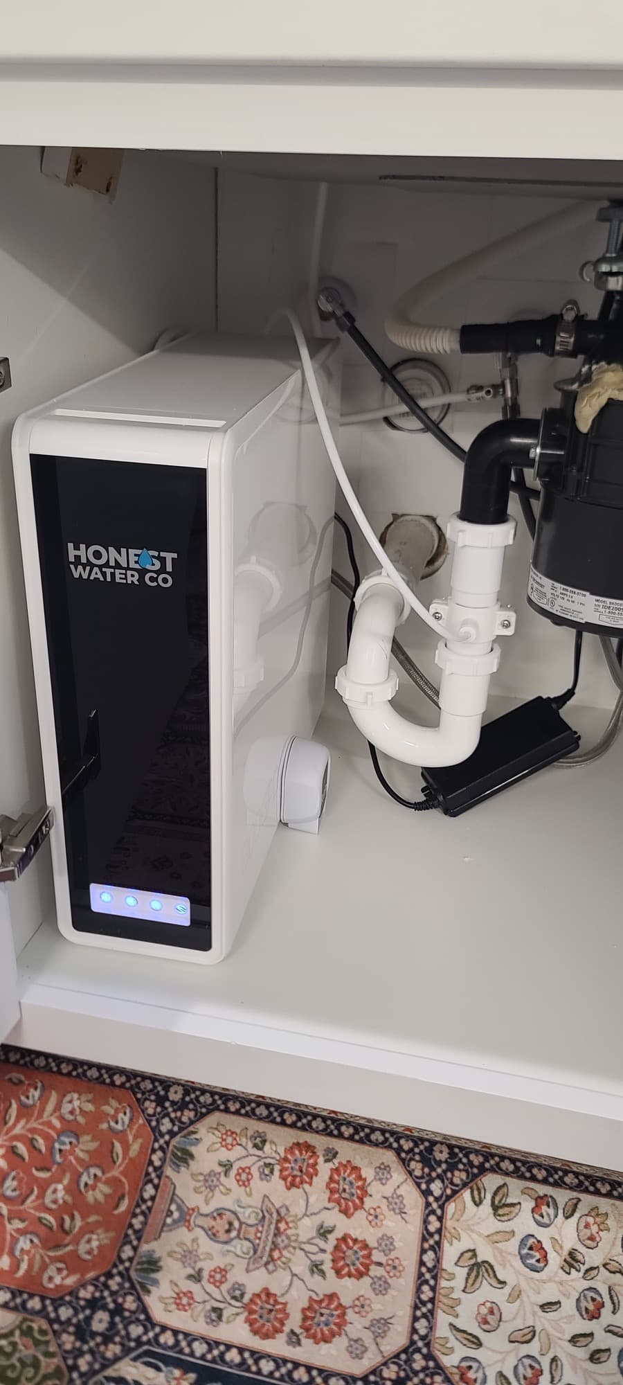 HW800 AlkaPro unit fitted under a kitchen sink alongside the existing plumbing